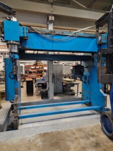 FKI's custom-modified press brake fabricating an 18-foot metal component for a truck trailer client, demonstrating unique engineering capabilities.